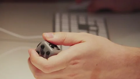Using a cube fidget when working on computer 스톡 동영상 130865533