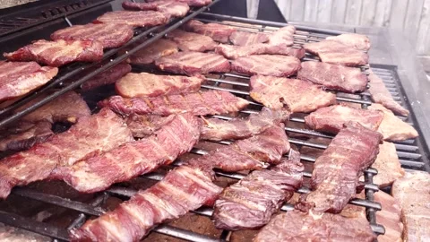 Using custom modified grill and smoker to make beef jerky Video stock 163240314