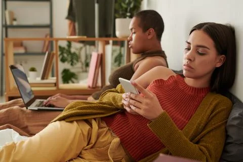 Using devices in bed Stock Photos