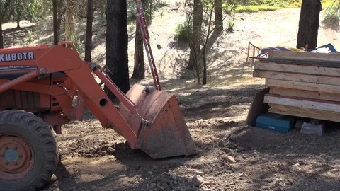 Using digger to compact dirt, mid shot, HD Stock Footage 123565876