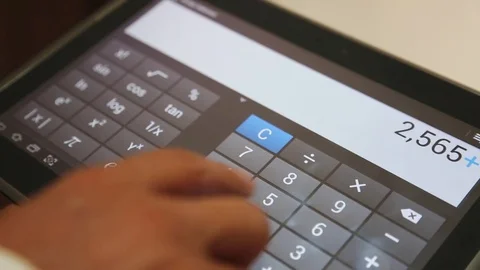 Using Digital Calculator on Tablet Screen Stockbeeldmateriaal 84835940