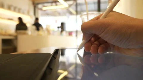 Using a digital pencil with graphic tablet,Close-up Stock Footage 166931948