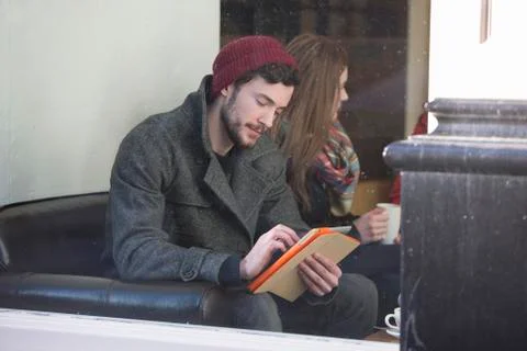 Using a digital tablet in a cafe Stock Photos