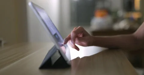 Using digital tablet at night Stock Footage