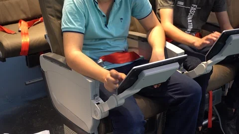 Using digital tablet on a plane Stock Footage 90633612