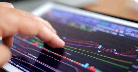 Using digital tablet for stock data information Stock Footage 79550496