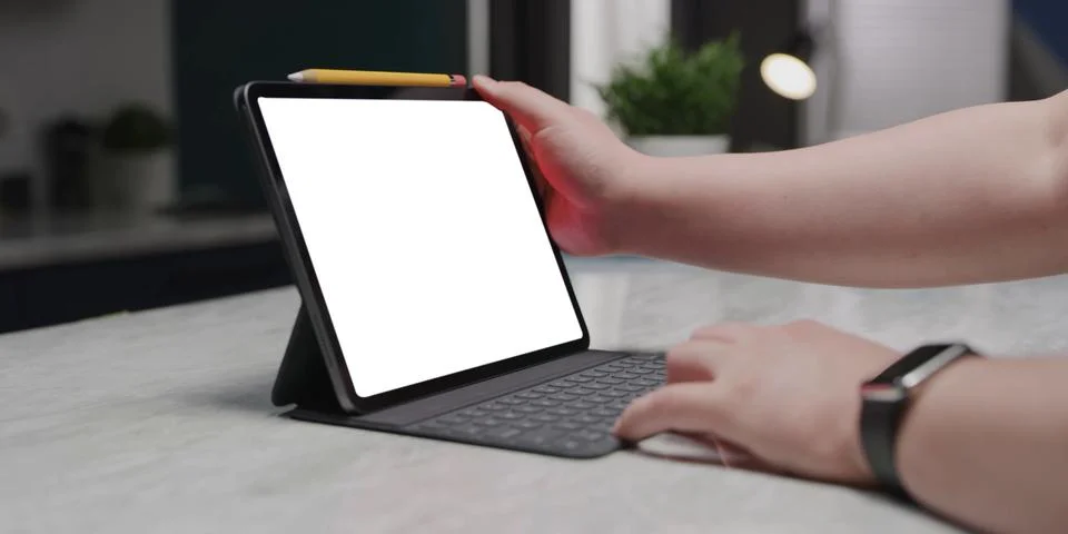 Using digital touchscreen tablet with stylus pen and smart keyboard Stock Photos