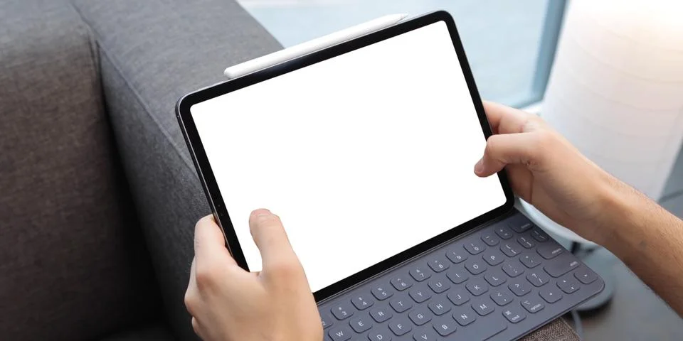 Using digital touchscreen tablet with stylus pen and smart keyboard Stock Photos