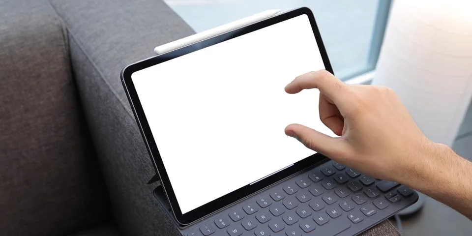 Using digital touchscreen tablet with stylus pen and smart keyboard Stock Photos