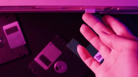 Using diskette close-up. Old floppy disk, disc drive top view. Retro computer. Stock Footage 206422306