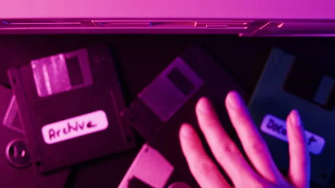 Using diskette close-up. Old floppy disk, disc drive top view. Retro computer. Stock Footage 206427530