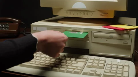 Using diskette FDD for old computer close-up. Hand inserting and ejecting Floppy Stock Footage 266084250