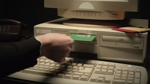 Using diskette FDD for old computer close-up. Hand inserting and ejecting Floppy Stock Footage 266084292