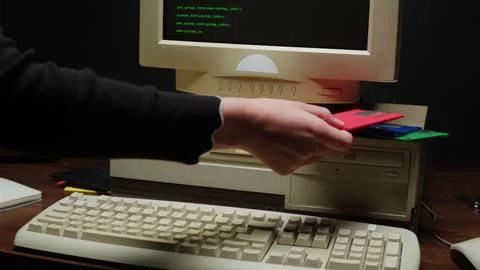 Using diskette FDD for old computer close-up. Hand inserting and ejecting Floppy Stock Footage 270099440