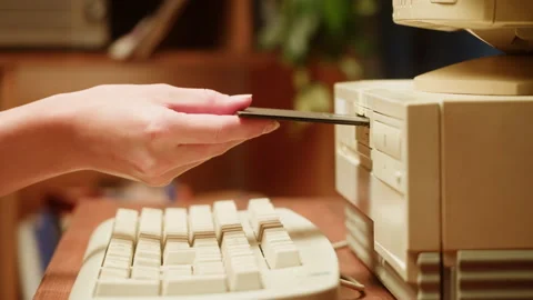 Using diskette for old computer. Music recorder, playing retro computer games Stock Footage 205902604