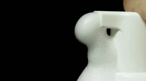 Using dispenser, closeup on dark background Vidéo 61246625