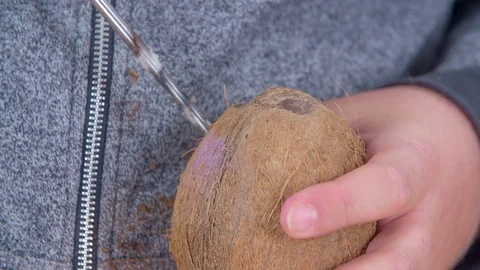 Using a drill to open a coconut Video stock 83725939