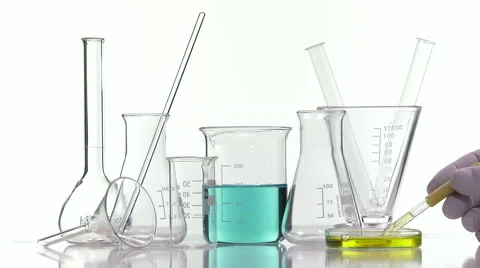 Using a dropper to transfer a yellow liquid from a petri dish Stock Footage 64290711