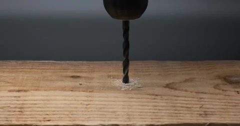 Using an electric drill to drill down the wood Stock Footage 148934790