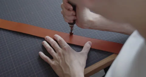Using electric grooving iron during leather belt making process Stock Footage 144891026