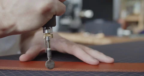 Using electric grooving iron during leather belt making process Stock Footage 144891186