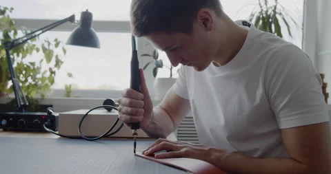 Using electric grooving iron during leather belt making process Stock Footage 144891274