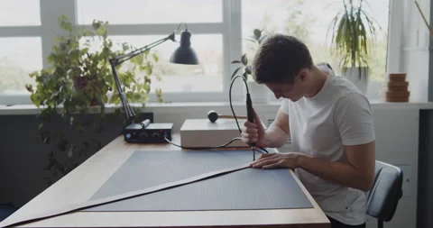 Using electric grooving iron during leather belt making process Stock Footage 146133409