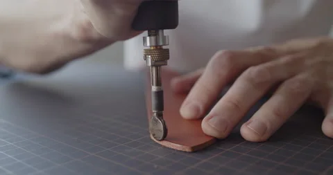 Using electric grooving iron during leather belt making process Stock Footage 146133567