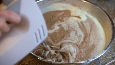Using an electric mixer to beat chocolate or cocoa powder, powder and flour Stock Footage 82452611