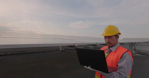 By using an electronic equipment, an engineer man inspects the construction o Stock Footage 164342245