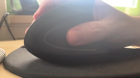 Using ergonomic mouse in home office workspace close-up Stock Footage 334042246
