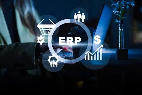 Using ERP software for business management and data analysis at night Stock Photos