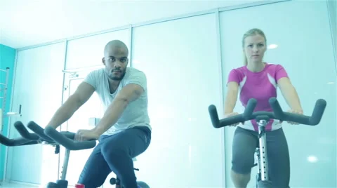 Using exercise bike in the gym Stock Footage 58787124
