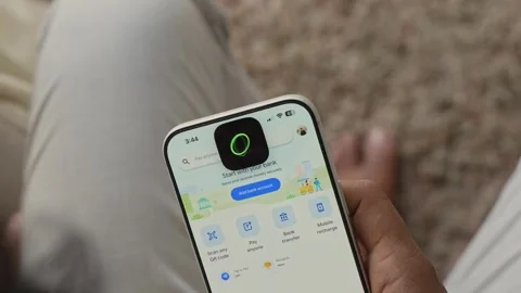 Using Face ID on an iPhone for unlocking a banking app on a smartphone Stock Footage 334016880