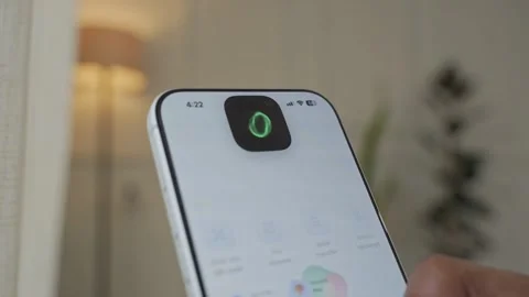 Using Face ID on an iPhone for unlocking a banking app on a smartphone Stock Footage 334016886