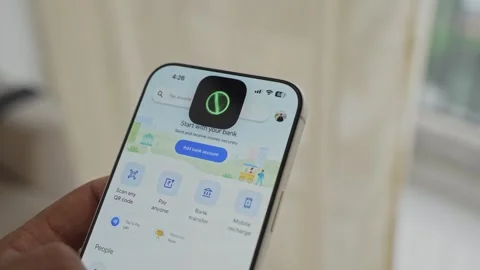 Using Face ID on an iPhone for unlocking a banking app on a smartphone Stock Footage 334016894