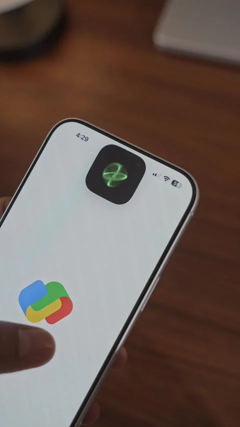 Using Face ID on an iPhone for unlocking a banking app on a smartphone Stock Footage 334016900
