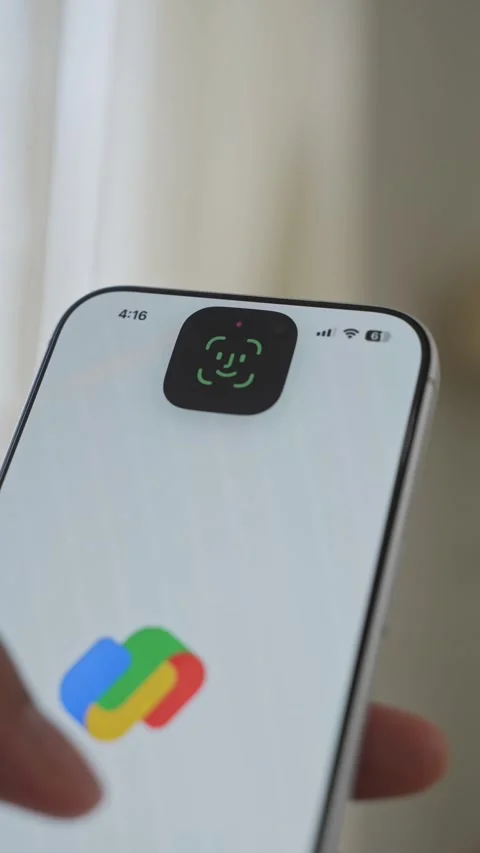 Using Face ID on an iPhone for unlocking a banking app on a smartphone Stock Footage 334016926