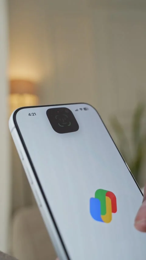 Using Face ID on an iPhone for unlocking a banking app on a smartphone Stock Footage 334016959