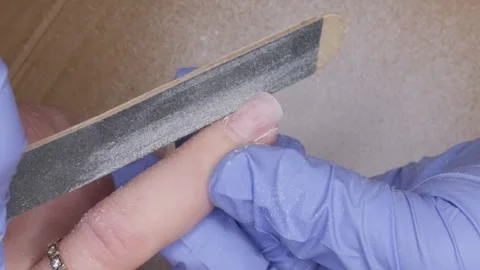 Using file to give beautiful shape to women's nails. Stock Footage 297659613