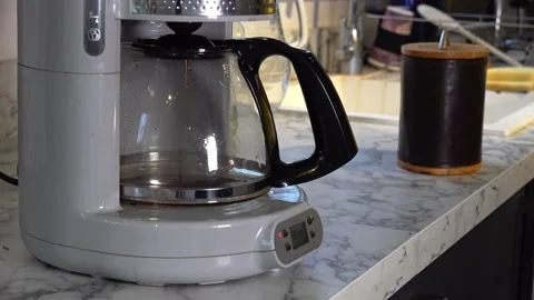 Using a filter coffe machine in the morning Stock Footage 146688617