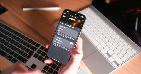 Using Final Cut Pro on iPhone with iPad and Keyboard on Desk Stock Footage 297732653