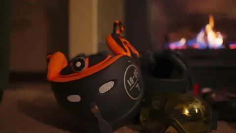 Using a fireplace to dry gloves in winter ski season Stock Footage 145552964