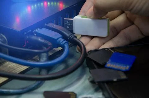 Using a flash drive, connecting to a computer via USB port. Stock Photos