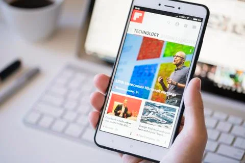 Using the Flipboard app on a smartphone Stock Photos
