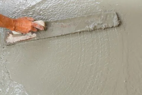 Using float to level surface of concrete Stock Photos