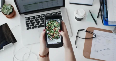 Using a food ordering delivery app at work Stock Footage 90299799