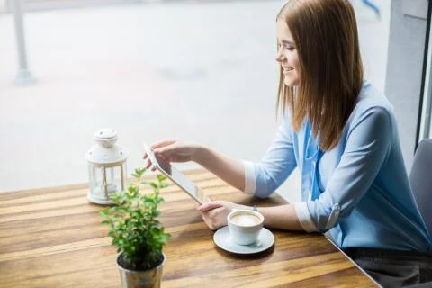 Using free wi-fi in cafe Stock Photos