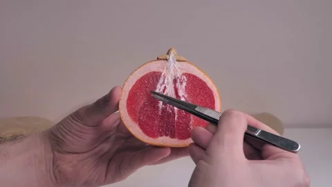 Using fresh fruits to demonstrate how our body works Stock Footage 150504123
