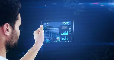 Using futuristic digital tablet, man exploring technology in virtual space 스톡 사진